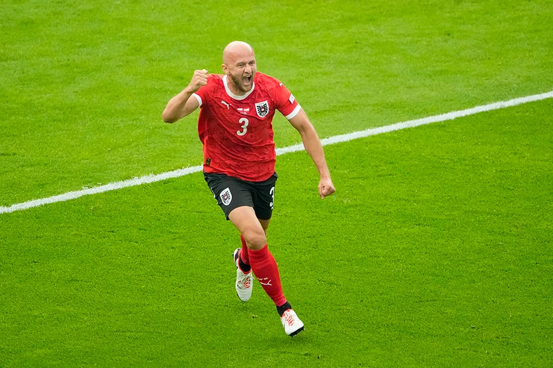 Austrias Gernot Trauner celebrates after scoring the opening goal 